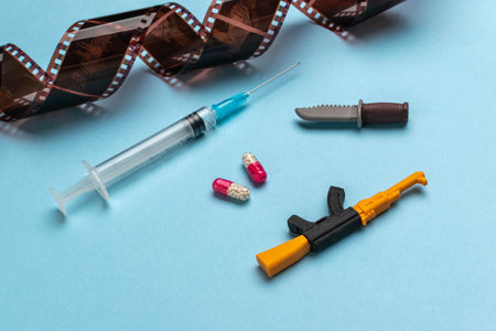 Conceptual Image Depicting Film, Drugs, and Violence through Miniature Toysの写真素材