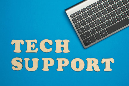 Modern Tech Support Concept with Keyboard on Blue Backgroundの写真素材