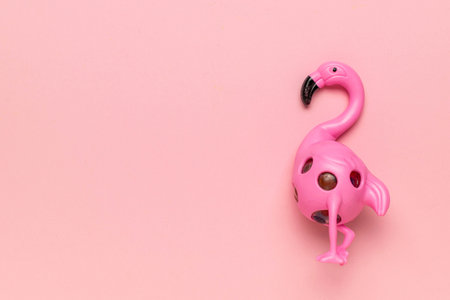 Pink Flamingo Toy on Soft Pastel Background - Minimalist Style for Playful Designの写真素材