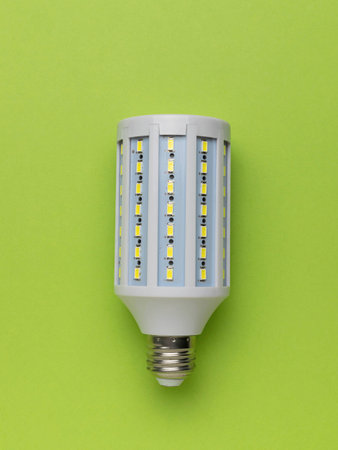 LED Light Bulb on Vibrant Green Background - Energy Efficiency and Modern Design in Stock...