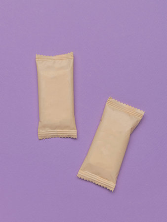 Two Beige Snack Packages on a Purple Background - Minimalist Food Packaging Design