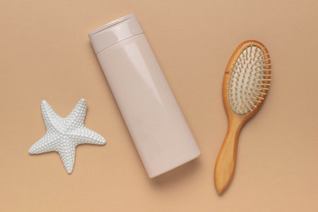 Natural Skincare: Shampoo, Wooden Brush, and Starfish on Pastel Backgroundの写真素材