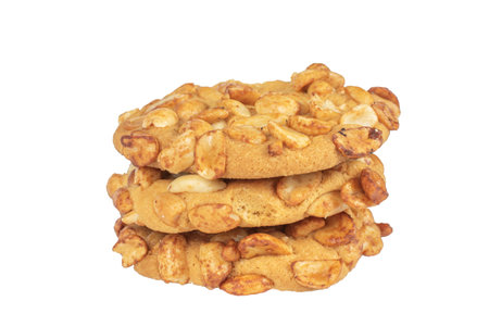 Stack of Crunchy Peanut Cookies on White Background - Delicious Dessert Treatsの写真素材