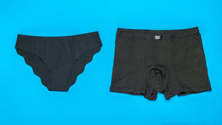 Black Seamless Underwear Set on Blue Background Trendy Flat Lay Fashion Stock Imageの写真素材