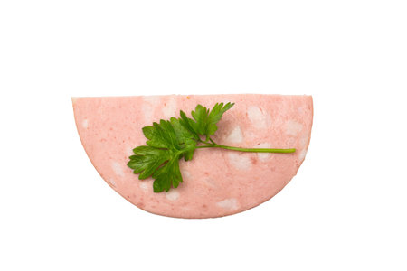 Close-Up of Half Circle Ham Slice Garnished with Fresh Parsley on Black Background
