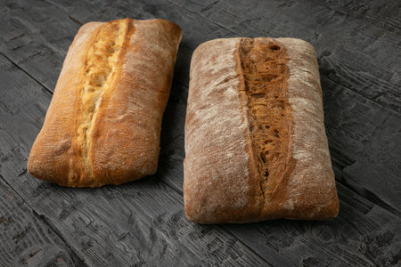 Rustic Italian Bread Loaves on Weathered Wooden Table - Artisan Baking with Ciabatta and Rye