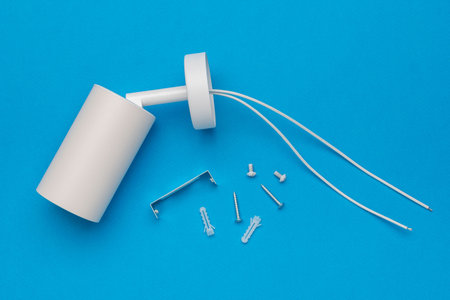 Minimalist Wall Lamp Parts on Blue Backgroundの写真素材