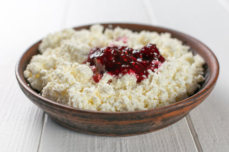 Rustic Cottage Cheese with Berry Jam on Wooden Table Fresh Breakfast Delightの写真素材
