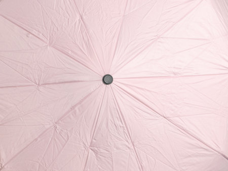 Minimalist Pink Umbrella: Elegant Top View Ideal for Contemporary Weather-Themed Stock Photographyの写真素材