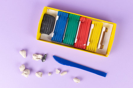 Colorful Clay Set and Knife on Pastel Background for Creative Art Projectsの写真素材