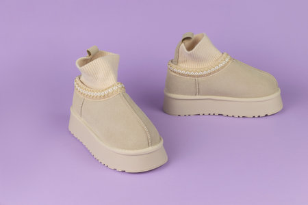 Beige Knitted Sock Sneakers on Purple Background - Modern Fashion Footwear Display