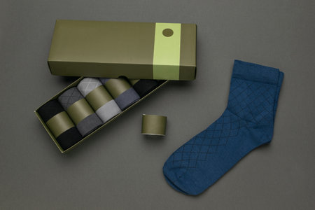 Elegant Boxed Argyle Socks Set with Blue Feature Pair on Gray Background
