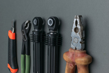 Set of Essential Hand Tools for Repairs and Maintenance on Gray Background