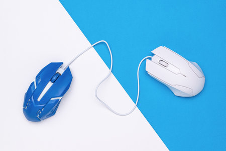 Modern Wired Optical Mice on Blue and White Geometric Background