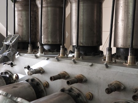Parts of the old aircraft engine. Nuts connecting tubes, nozzles, cylinders, insulation of the...