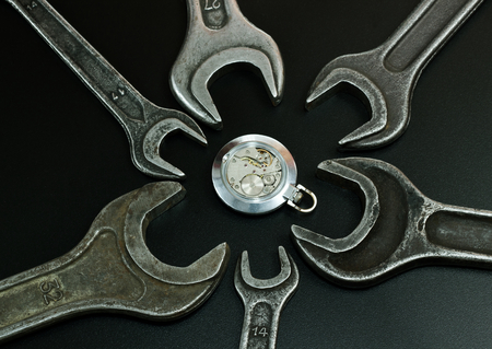 The clock mechanism is surrounded of spanners,の写真素材