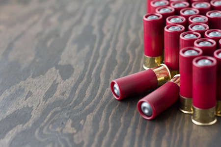 Several shotgun shells standing up and tipped overの写真素材