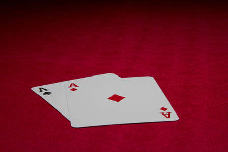 Two ace cards on red backgroundの写真素材