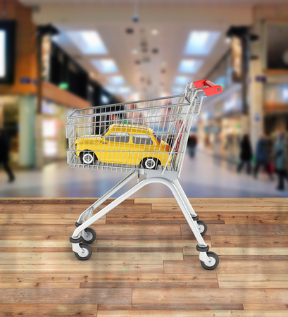 small retro car in the shopping trolley on shopping center background 3dの写真素材