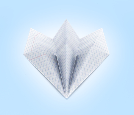 paper plane made with graph paper on blue gradient background front view 3dの写真素材