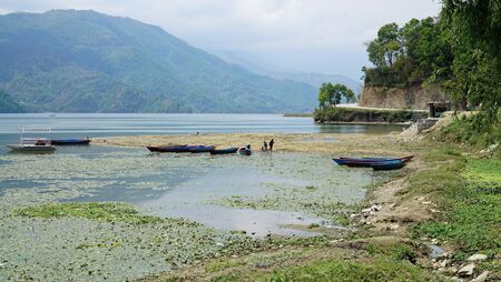 Phewa Lake a Cloudy Day and wooden color Boatsの写真素材