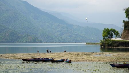 Phewa Lake a Cloudy Day and wooden color Boatsの写真素材