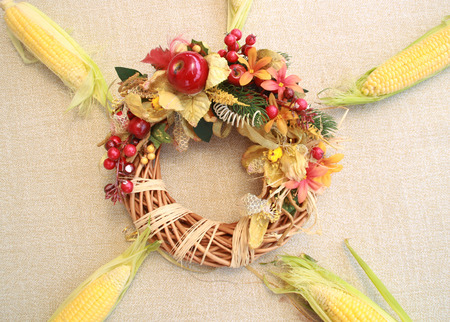 Fall composition for thanksgiving day with corn,apple,mushrooms and pumpkinの写真素材