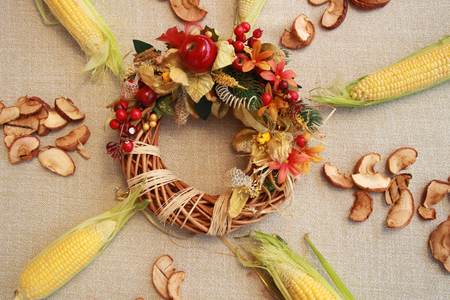 Fall composition for thanksgiving day with corn,apple,mushrooms and pumpkinの写真素材
