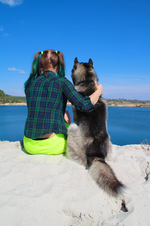 Photo of best friends girl and her husky.の写真素材