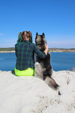 Photo of best friends girl and her husky.の写真素材