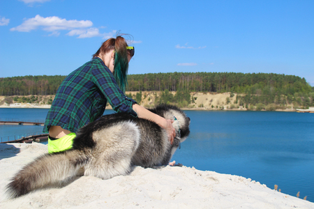 Photo of best friends girl and her husky.の写真素材