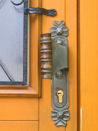 Metal forged handle and steel fitting of Wooden Medieval Antique door.の写真素材