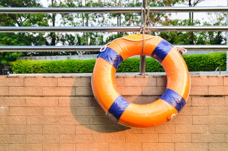 Life Buoy attached to a swimming pool Wallの写真素材