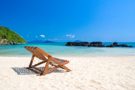 beautiful beach and chair with blue sky の写真素材