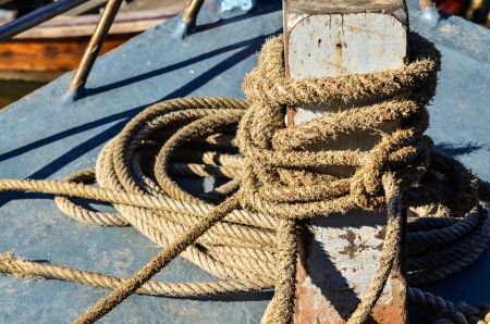 Ship hemp cable bound over a bollardの写真素材