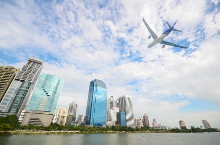 plane over business cityの写真素材