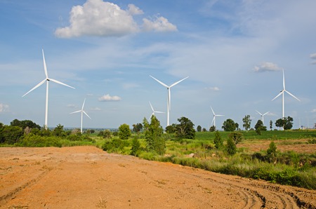 wind turbine against cloudy blue sky background