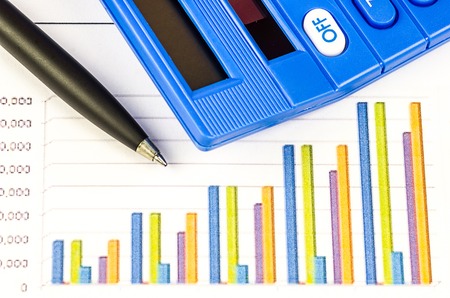 calculator, pen and graph of business analysisの写真素材