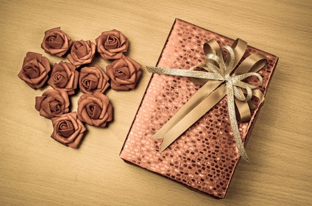 red gift box on wood backgroundの写真素材