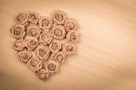 red heart shape on wood backgroundの写真素材