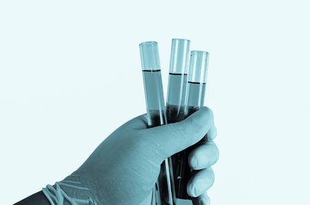 Scientist hand holding test tubes ,Laboratory research conceptの写真素材