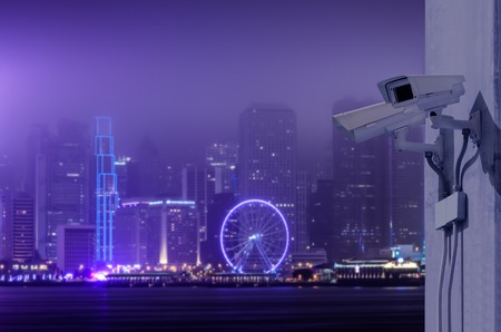 Surveillance Security Camera or CCTV over Hong Kong night cityの写真素材