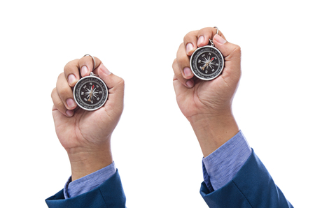 businessman hand holding compass isolated on white backgroundの写真素材