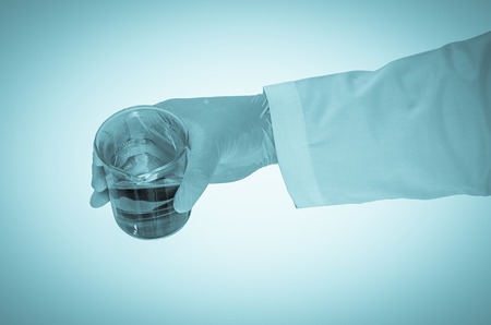 Scientist hand holding test tubesの写真素材