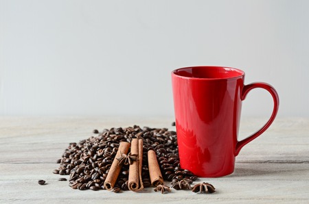 Red coffee cup on wooden tableの写真素材
