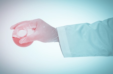 Scientist hand holding test tubesの写真素材