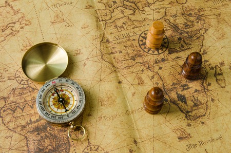 Compass and Chess on old mapの写真素材