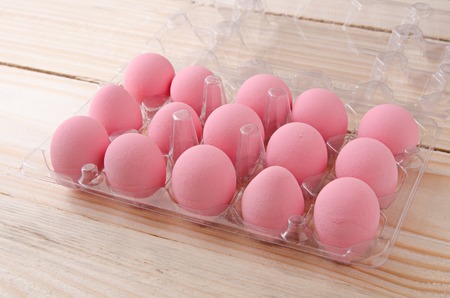 pink egg in plastic boxの写真素材
