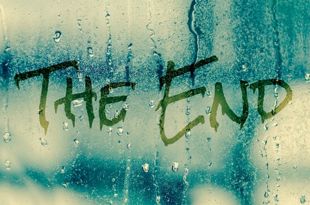 natural water drops on glass window with the text "The end"の写真素材