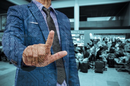 business man hand touching virtual screen on blur backgroundの写真素材